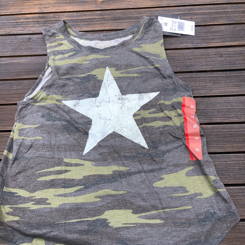 A camouflage tank top with a white star